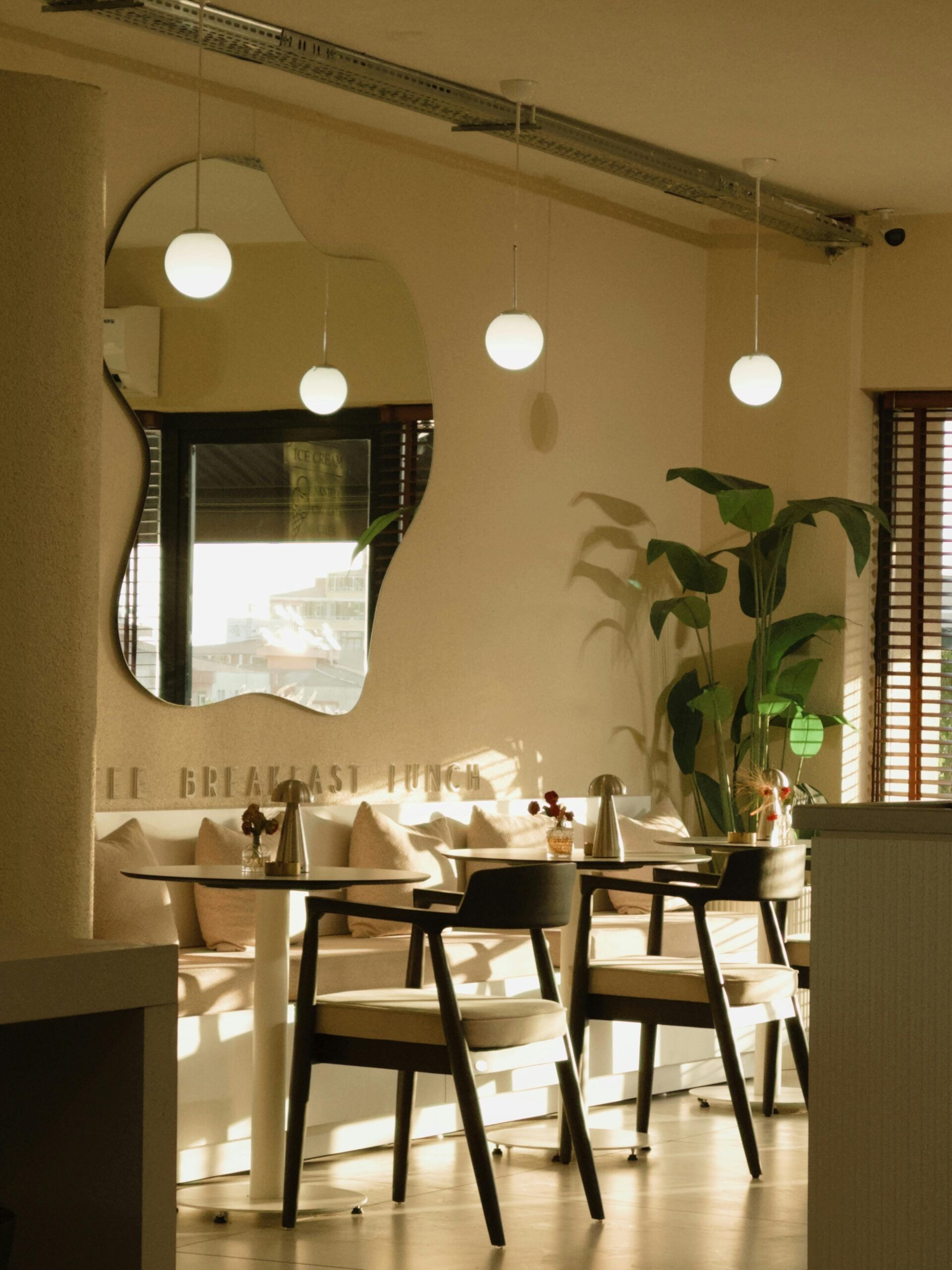 Warmly lit cafe interior with modern design and elegant decor, perfect for a relaxing meal.