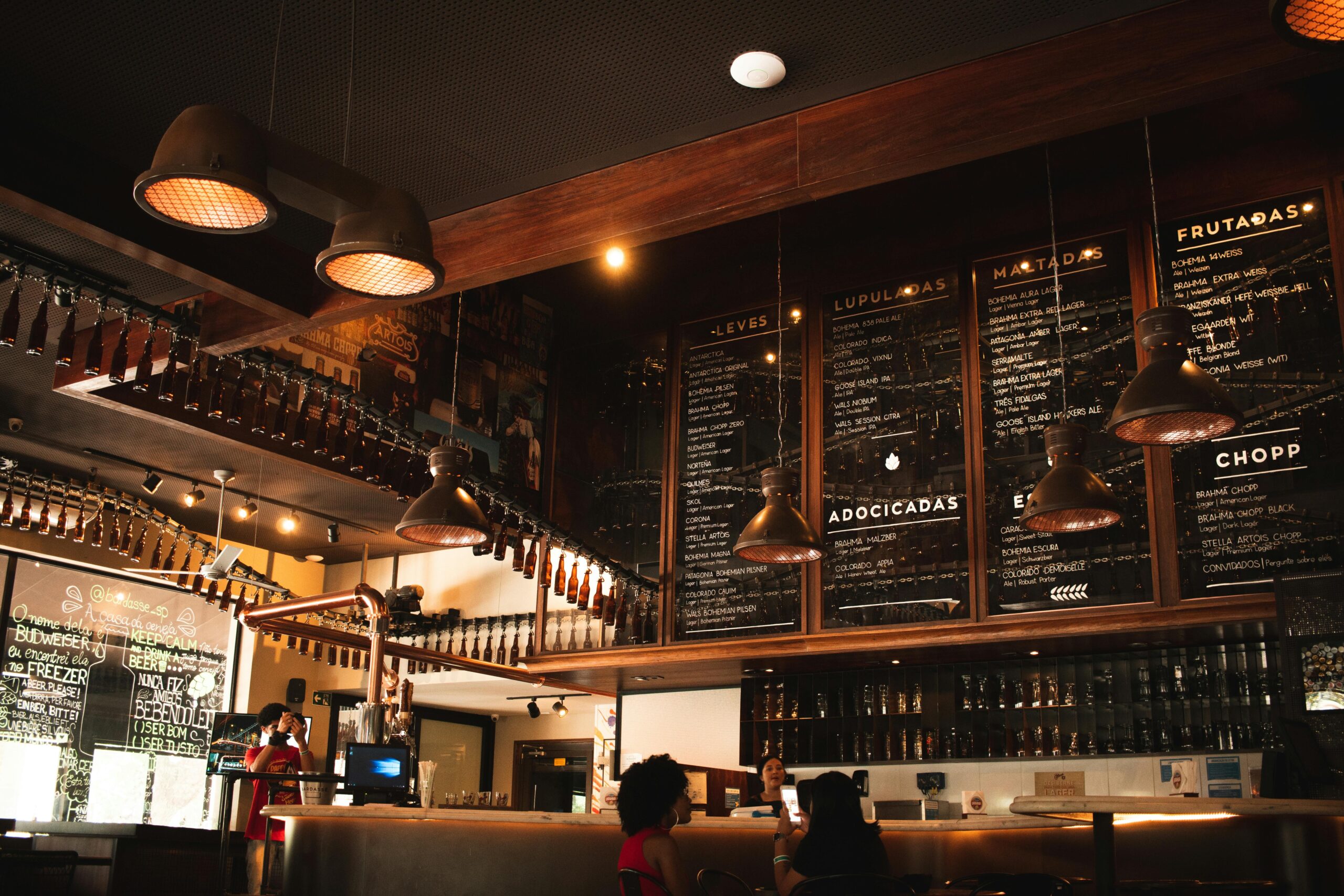 Warm and inviting café interior featuring wooden decor and ambient lighting.